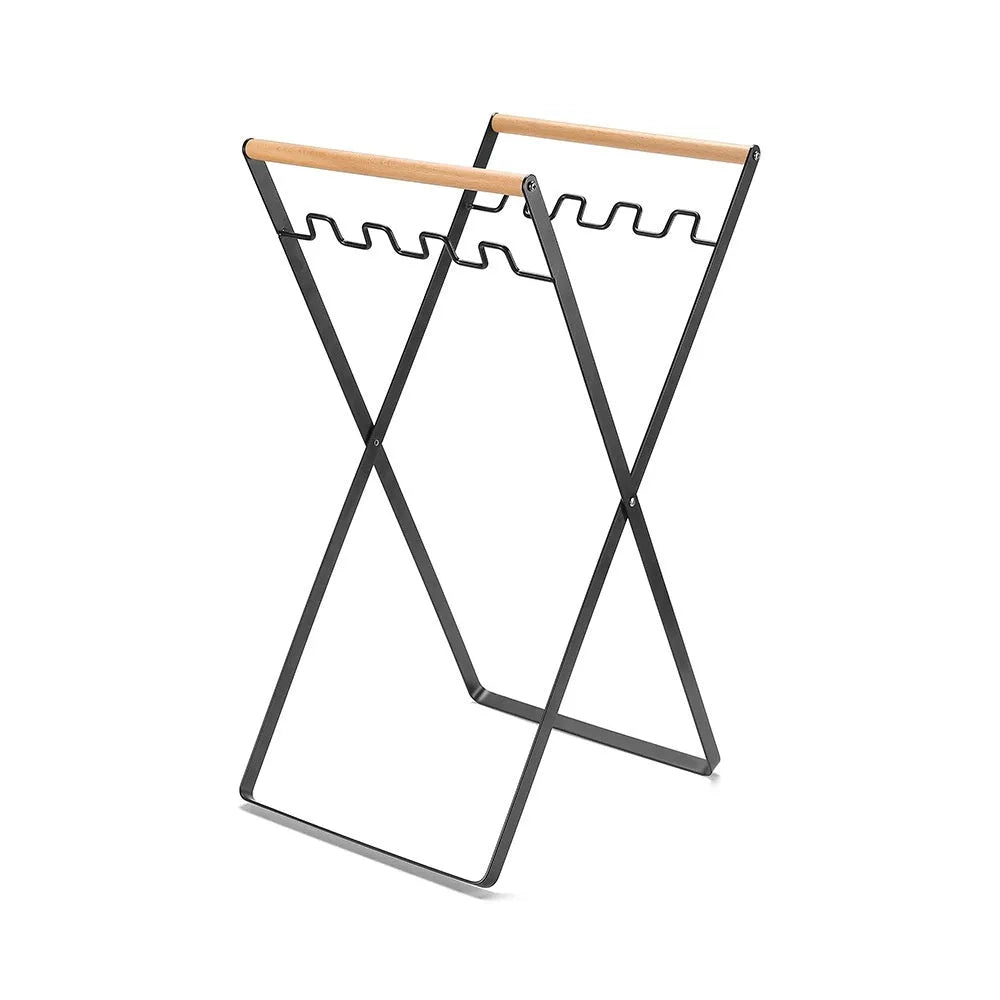 Folding outdoor rubbish rack with iron frame and wooden handle, shown in black colour.