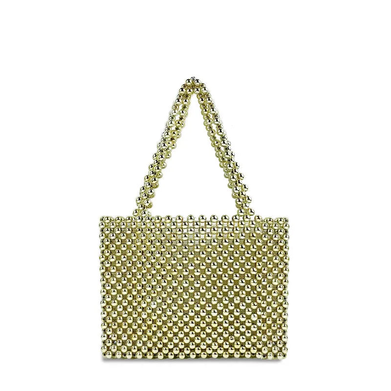Gold hand-woven metal beads steamed crystal pearl bag, square vertical shape with double shoulder straps on a lady