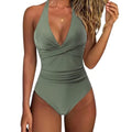Women's solid colour one-piece swimsuit in bikini style on a mannequin.