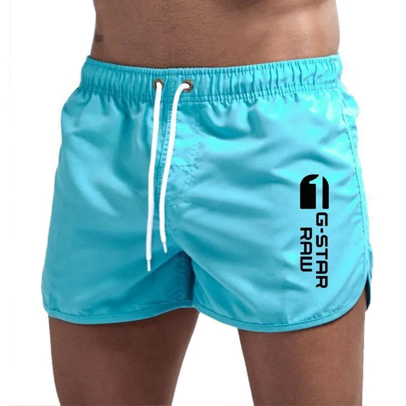 Man wearing lightweight polyester hemp-blended sports shorts in a vibrant colour with a micro-elastic waistband.