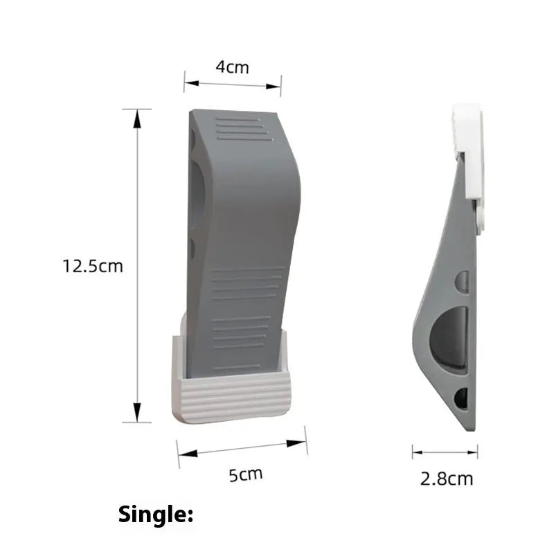 Gray rubber arch-shaped door stopper with a non-slip base on a light floor surface