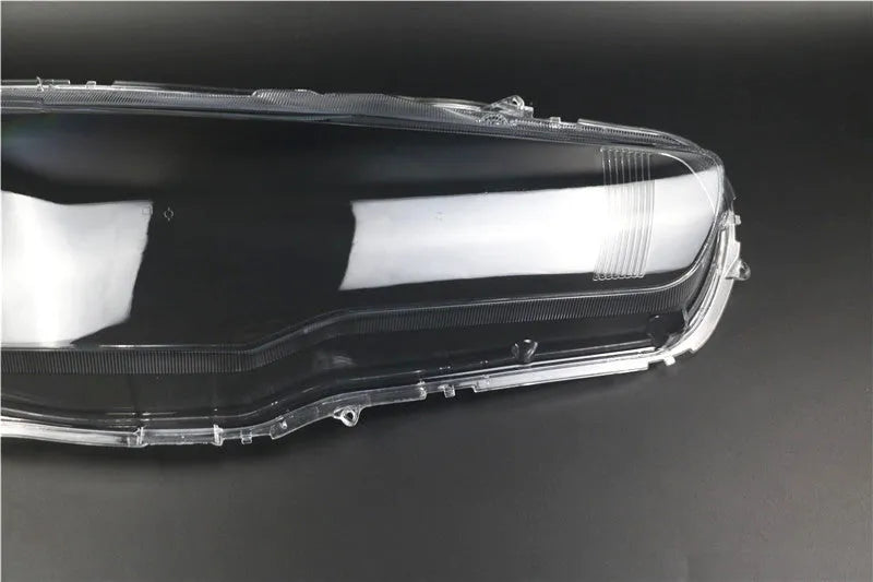 Transparent plastic car headlight housing cover showing clear construction and 50x30x20mm dimensions