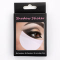 Pack of half-moon shaped disposable eyeshadow shields on a pink background