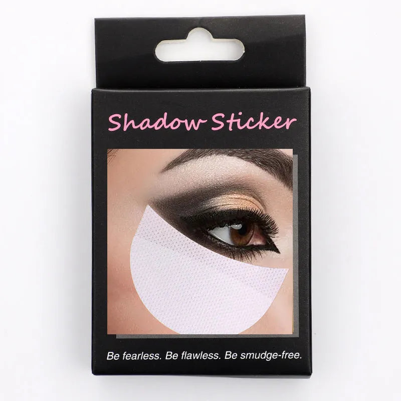 Pack of half-moon shaped disposable eyeshadow shields on a pink background