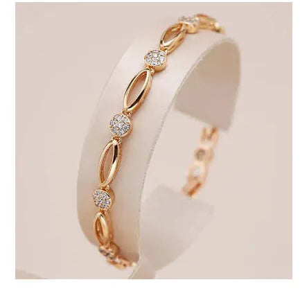 Golden copper hollow carved U-shaped women's bracelet showing openwork pattern