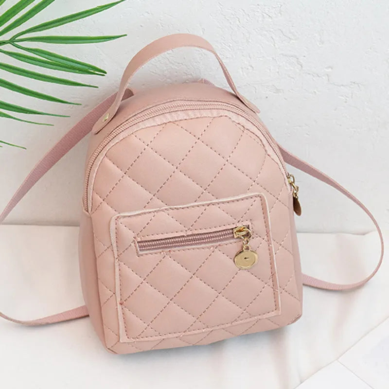 Girls' hard square PU backpack with embroidery in pink, showing front sandwich pocket and carry handle.