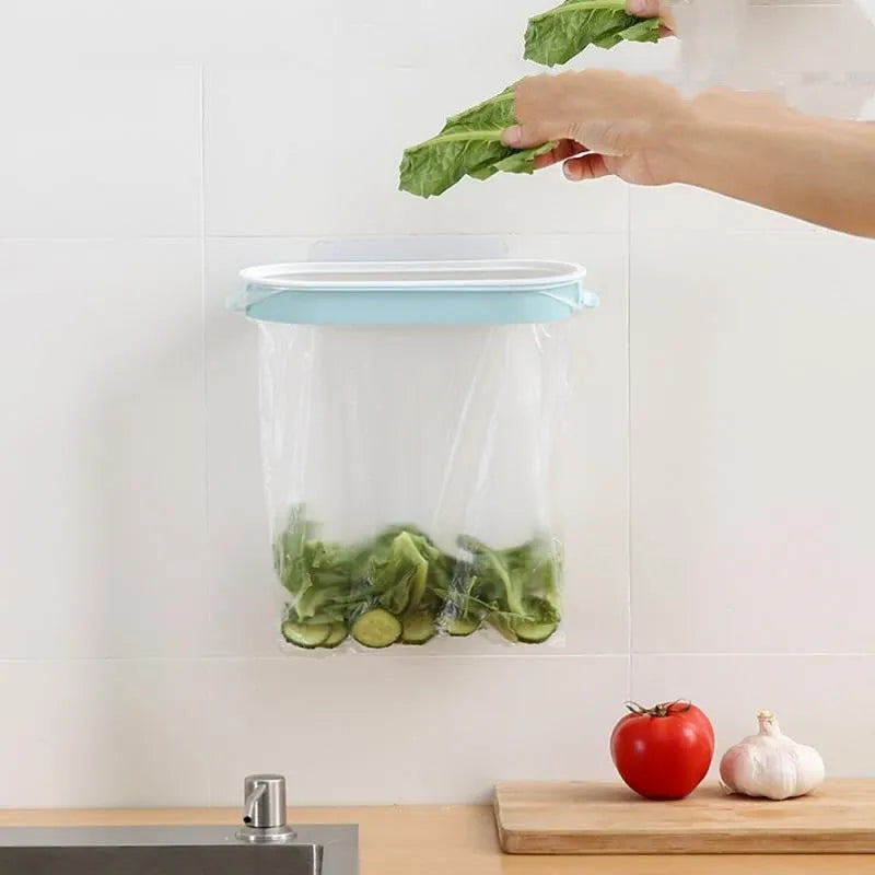 Blue plastic T-shaped kitchen cabinet storage rack for holding a roll of bin bags.
