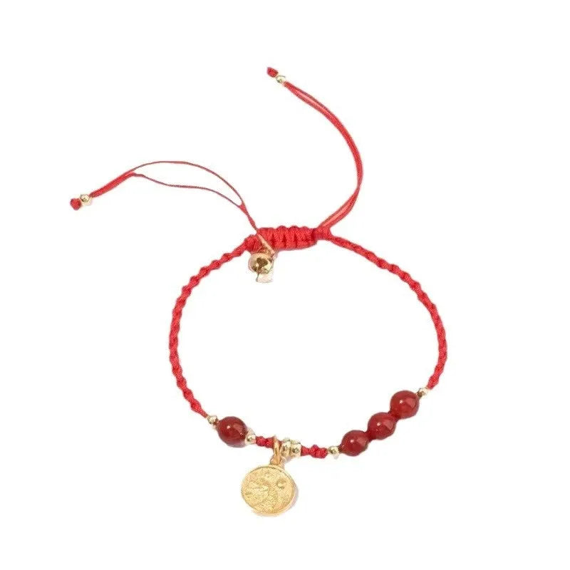 Cinnabar exam luck bracelet with braided rope strap and choice of bead or flower charm in ethnic style