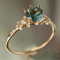 Gold geometric claw ring with micro inlaid zircon stones and chamfered square pattern