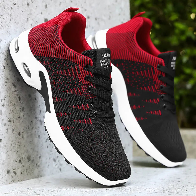 Men's low-top Flyknit mesh sneaker in black and grey colour with lace-up front and soft sole.