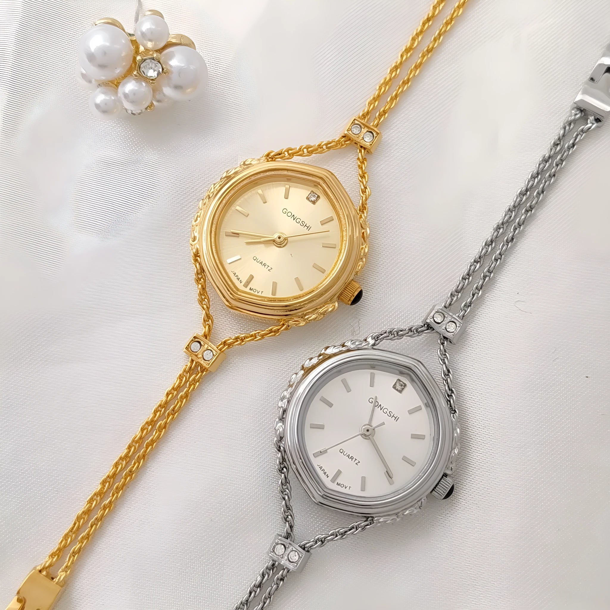 Women's Mori style quartz watch in gold or silver with a 25mm dial and chain strap.