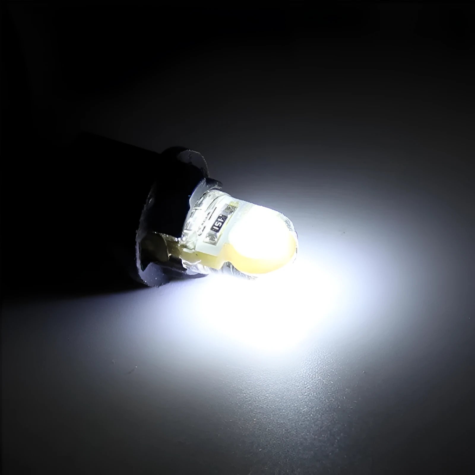 Pack of ten T10 wedge base LED bulbs for cars in seven different colours on a white background