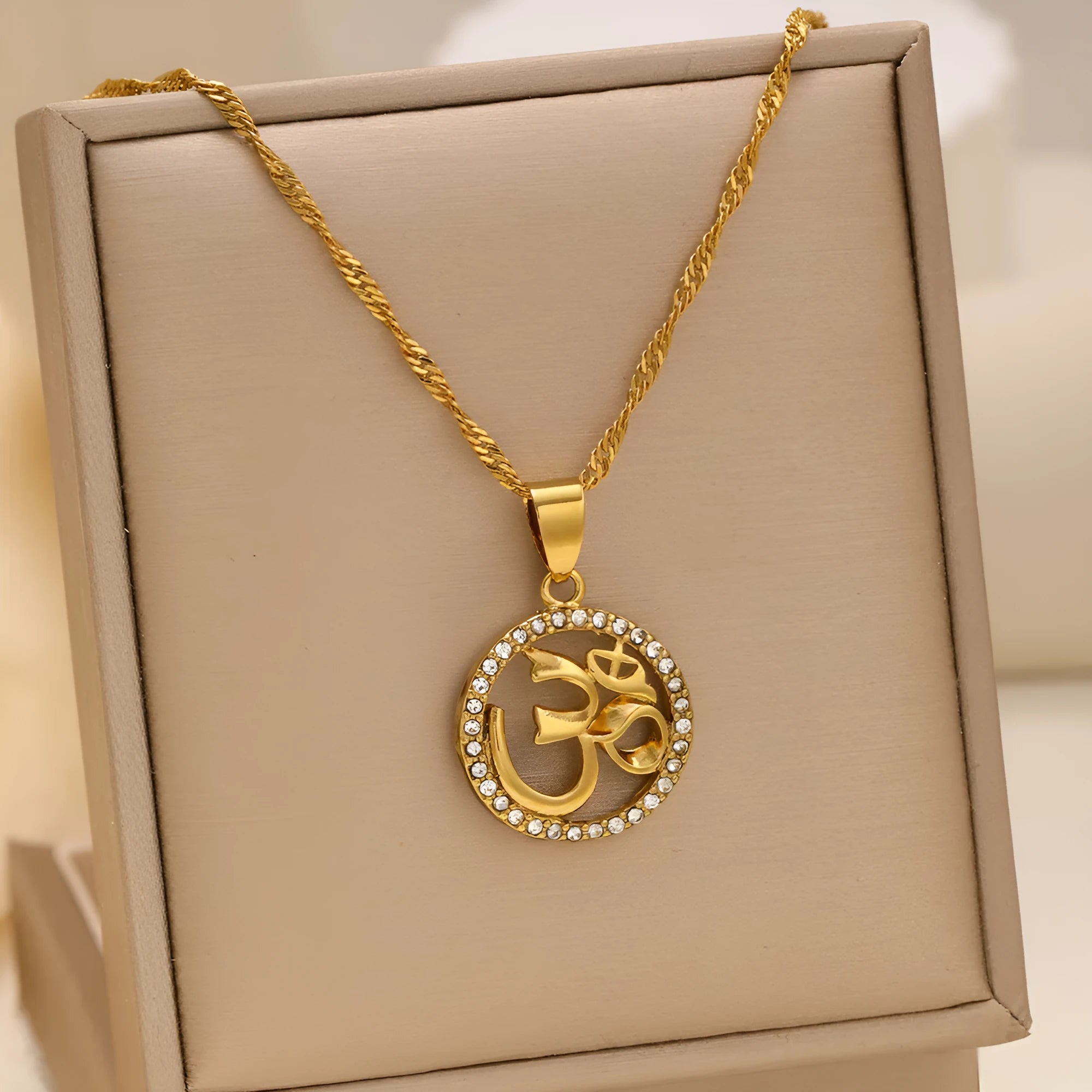 Gold plated copper circular pendant necklace with diamond edge inlay and OM symbol