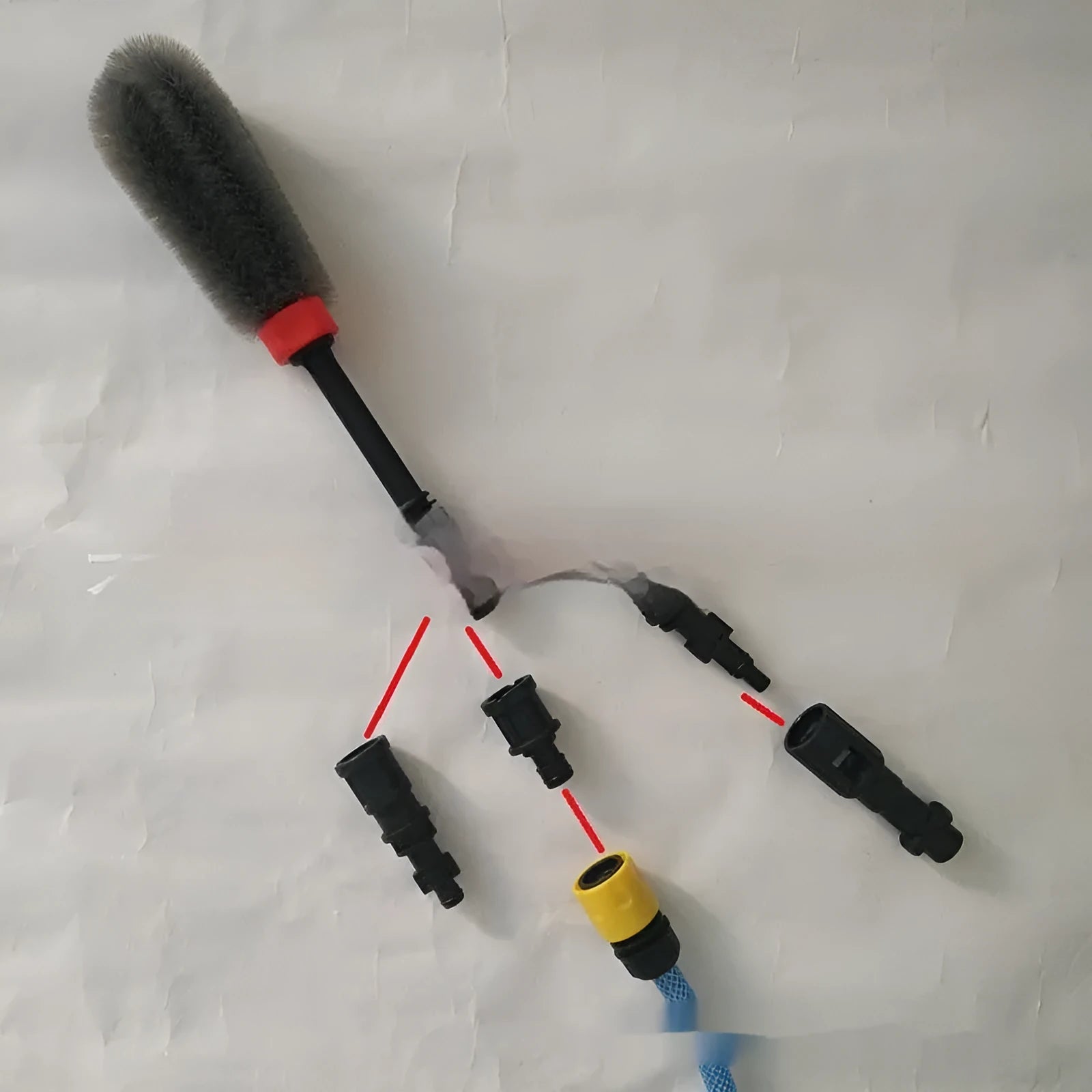 Quick plug high-pressure car wash wheel hub brush with steel wire bristles and flow-through design