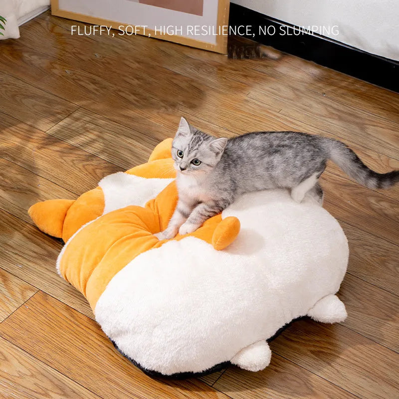 Orange semi-enclosed cat sleeping bag bed on a floor, showing its nest shape and dimensions.