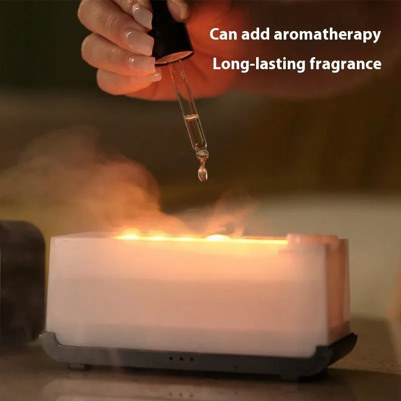White USB aromatherapy flame diffuser humidifier with mood lighting on a wooden table.
