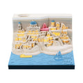 Illuminated 3D paper carving model of Santorini beach with integrated notepad