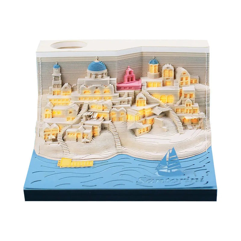 Illuminated 3D paper carving model of Santorini beach with integrated notepad