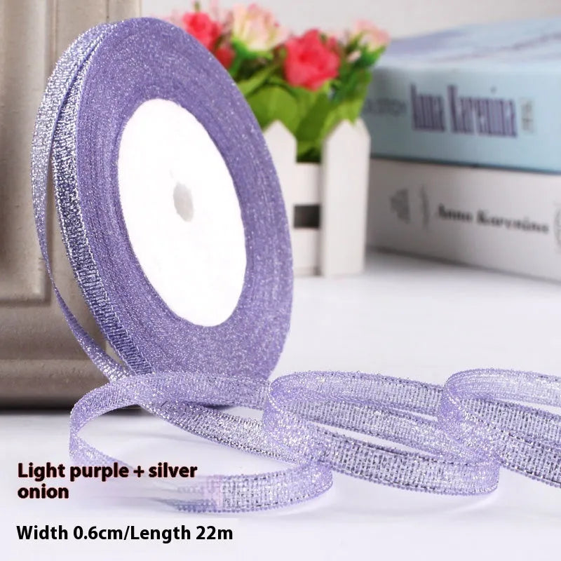 Roll of 0.6cm wide polyester gift packaging ribbon in a choice of 22 colours including gold leaf and jade pink.