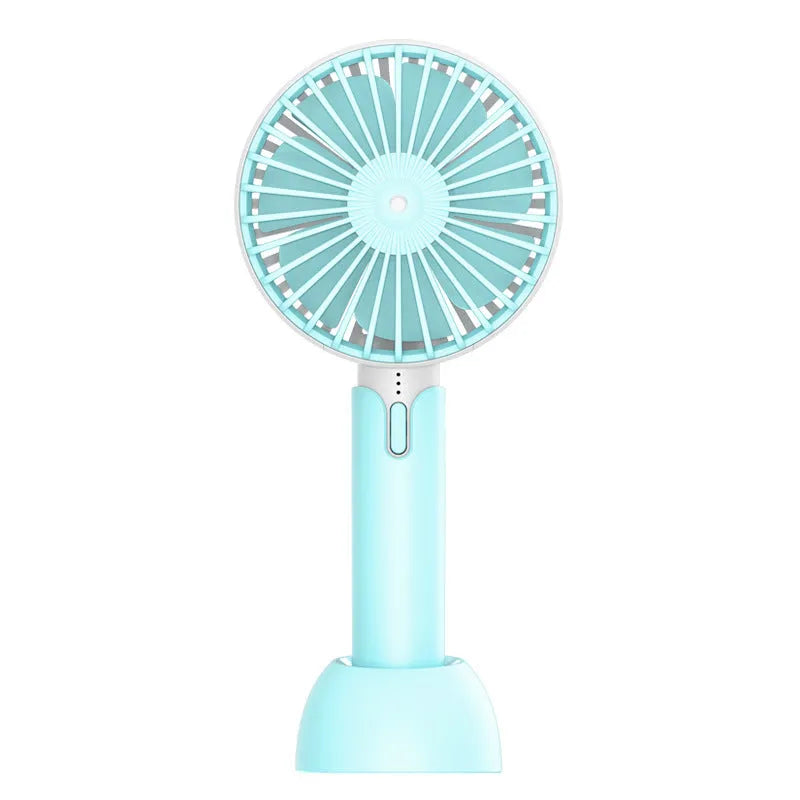 Blue handheld mini USB electric fan with three-speed control on a desktop.