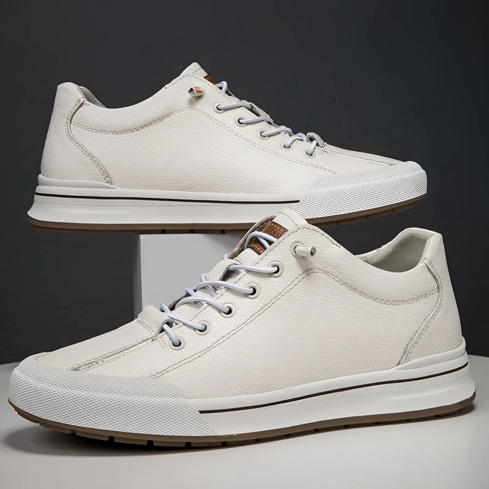 Men's round-toe casual shoes in matte leather, showing flat heel and breathable design on a white background.