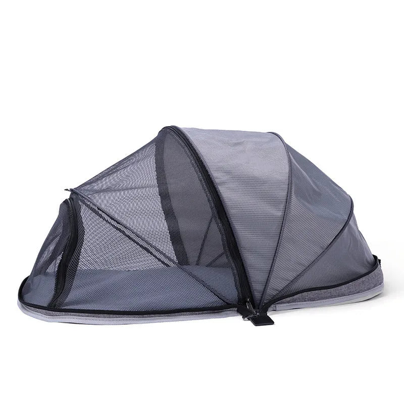 Portable folding cat tent with half-mesh side in blue, set up on a floor.