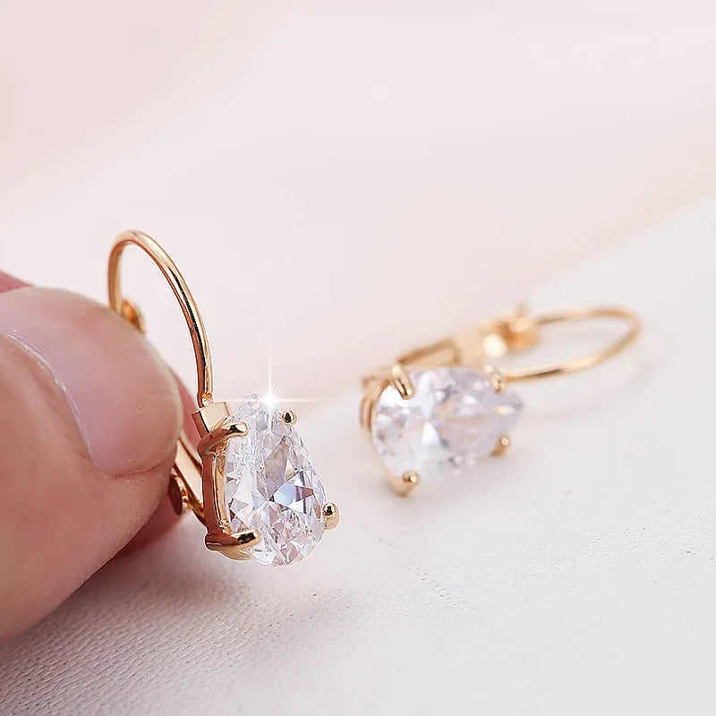 Women's drop-shaped metal earrings with platinum gemstone decoration in gold and platinum colour options