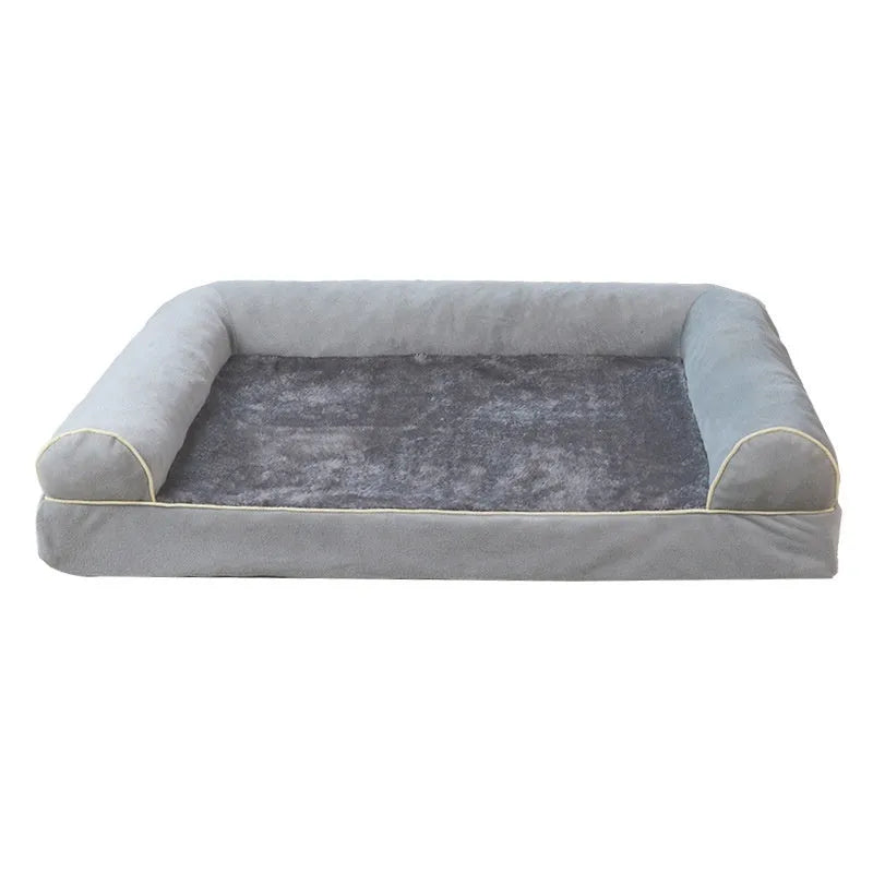 Square blue cloth dog bed with sponge filling on a wooden floor.