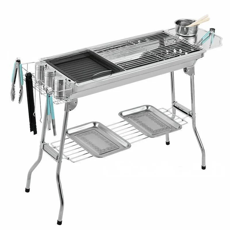 Stainless steel portable barbecue oven with charcoal stove and cooking accessories