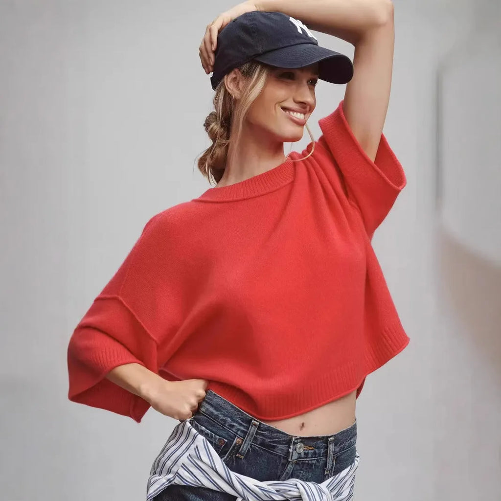 Red viscose short t-shirt with exposed navel detail on a mannequin, showing regular sleeves and pullover style.