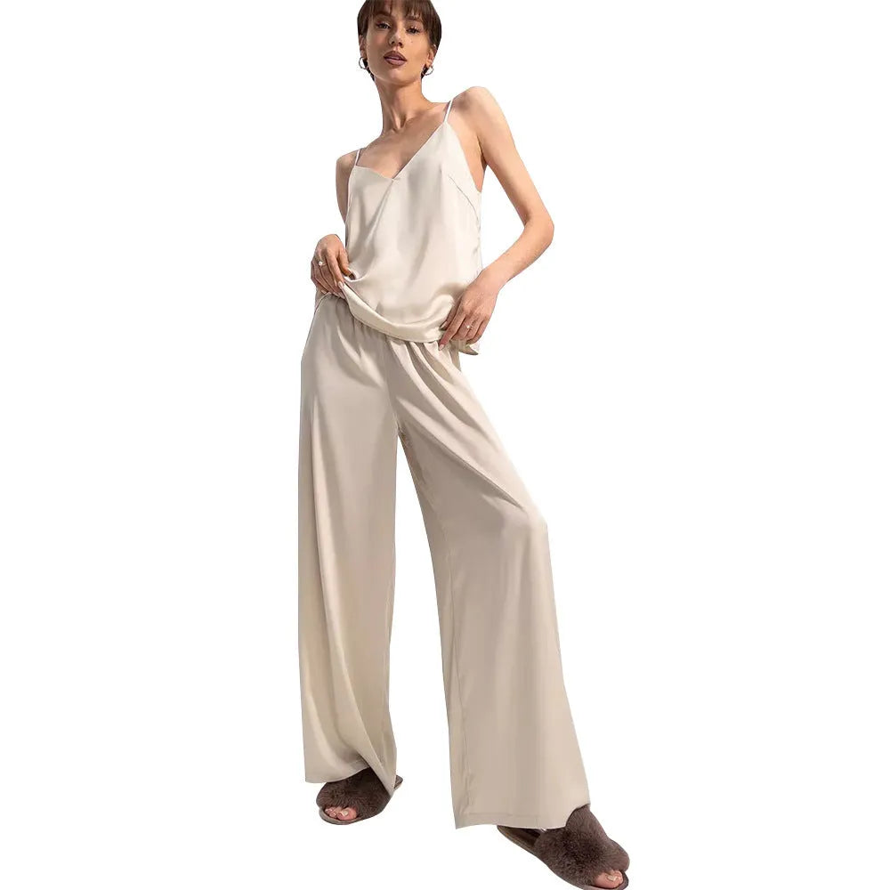 Polyester suspender trousers pyjama suit in navy blue with European American style top and matching trousers on model