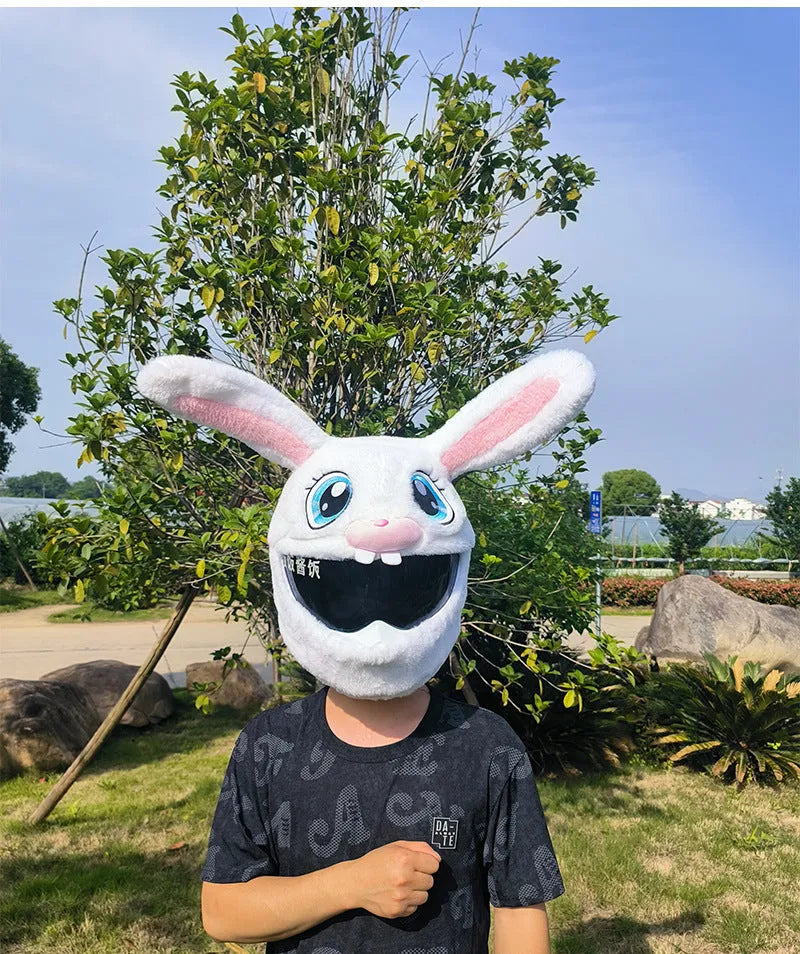 White decorative rabbit head cover for an electric motorcycle helmet with long ears and plush lining.