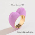 Three-dimensional heart-shaped enamel ring in multiple colours on a zinc alloy band.