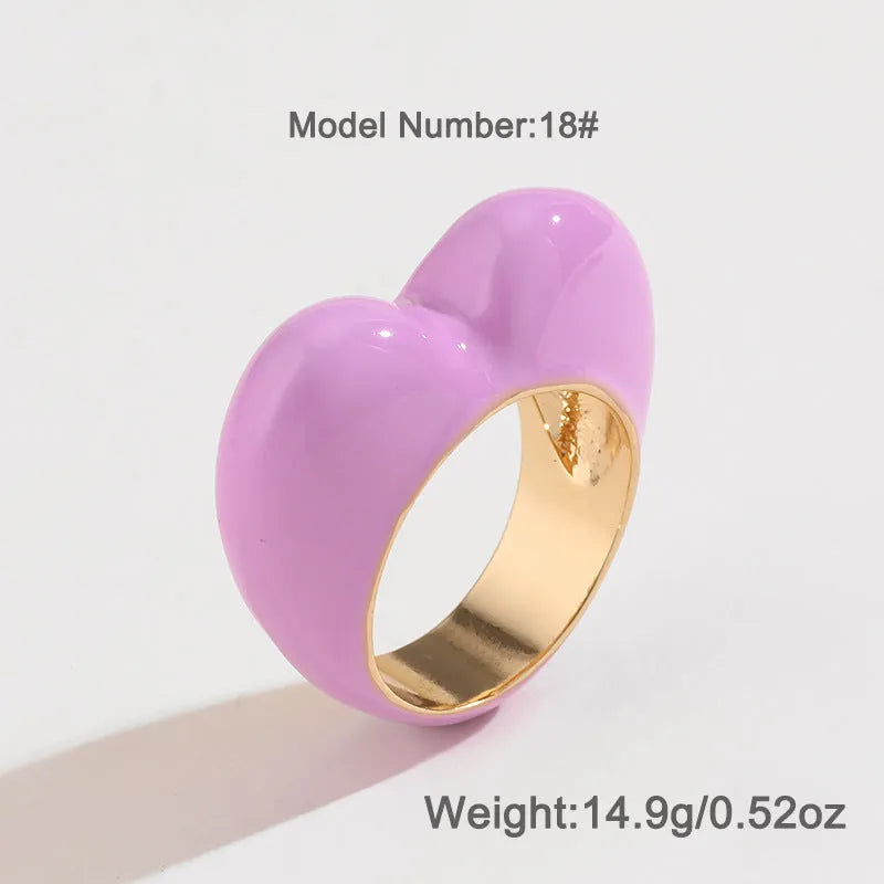 Three-dimensional heart-shaped enamel ring in multiple colours on a zinc alloy band.