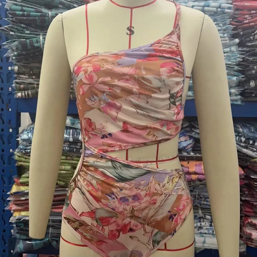 Rose gold patterned women's one-piece swimsuit on a mannequin.