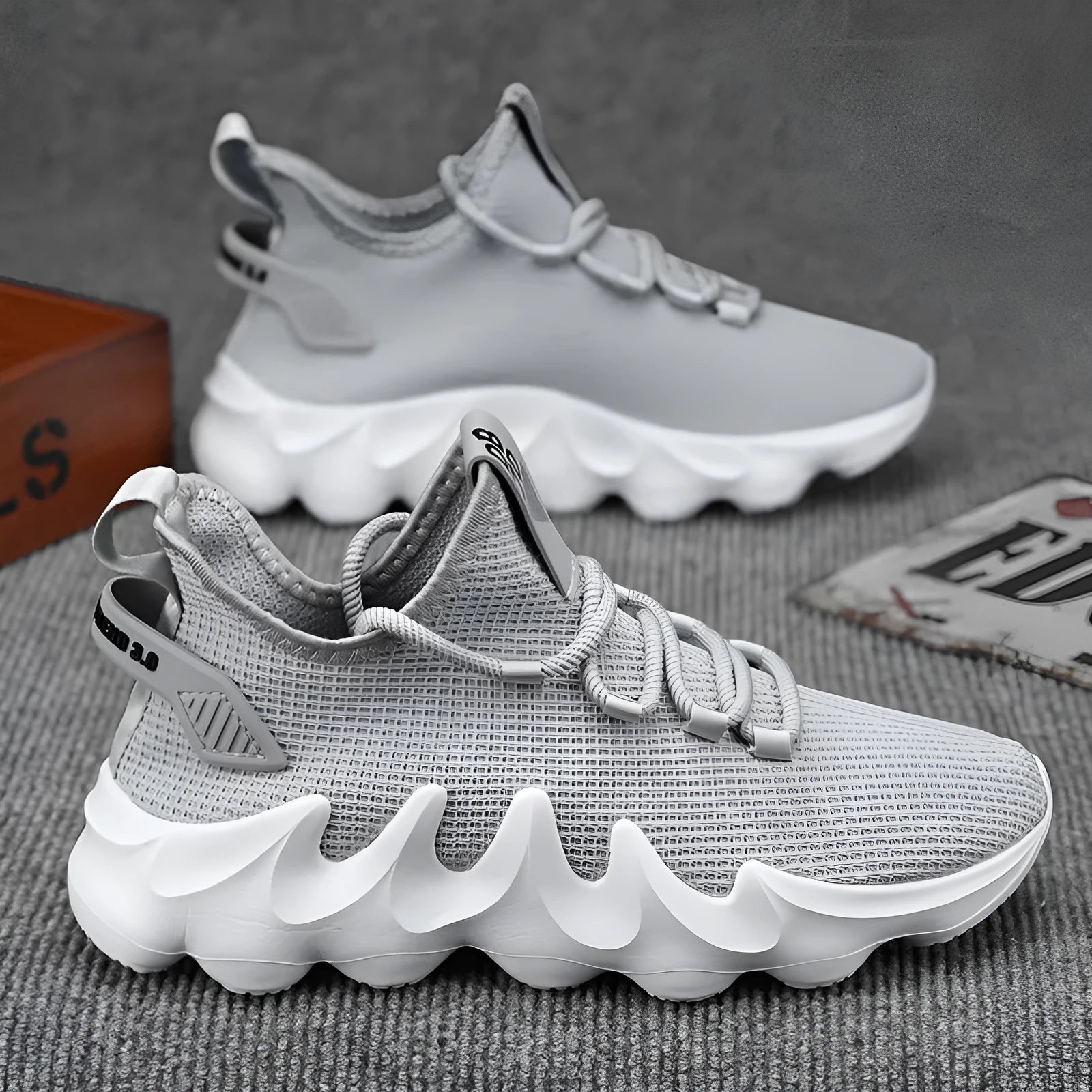 Men's black lightweight sock-like sports shoes with flat rubber sole and lace-up front.