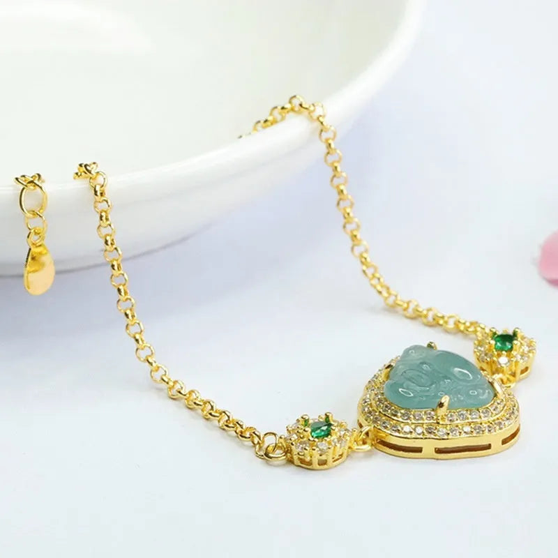 Emerald blue water jade bracelet with inlaid Maitreya Buddha carving, women's jewellery accessory.