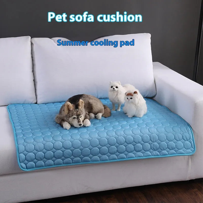 Extra large dog cooling mat in gray with breathable mesh surface for summer pet heat relief on a sofa