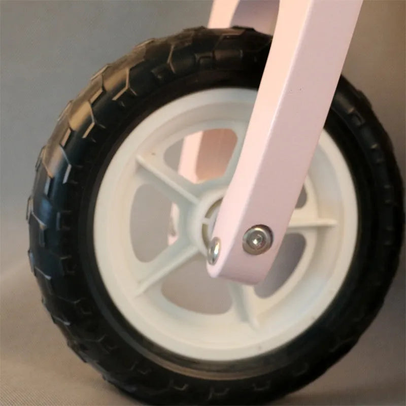 Pink wooden toddler balance scooter with 10-inch wheels for children aged 1-6.