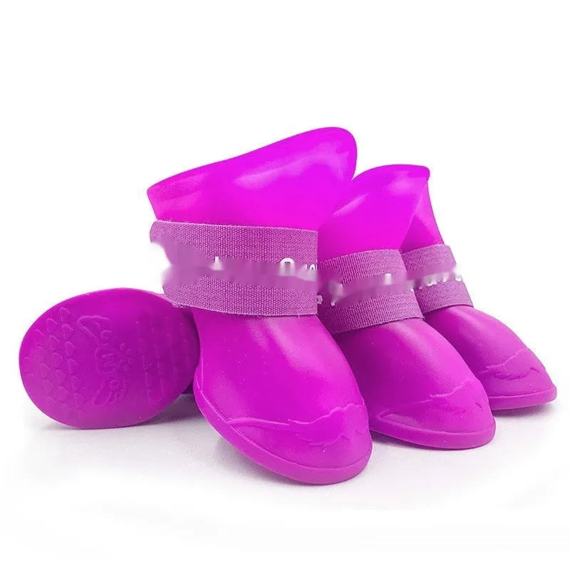 Set of four colourful rubber pet rain shoes with soft soles for dogs or cats.