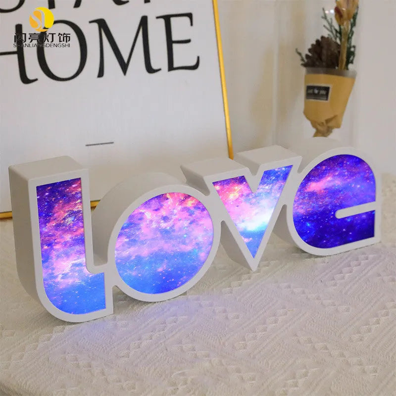 Rainbow-colour plastic LED LOVE light decoration measuring 35.5cm tall with 'LOVE' lettering