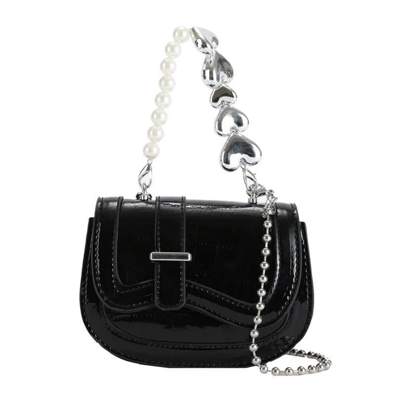 PU women's crossbody bag with laser pearl finish in silver colour showing horizontal square shape and shoulder strap