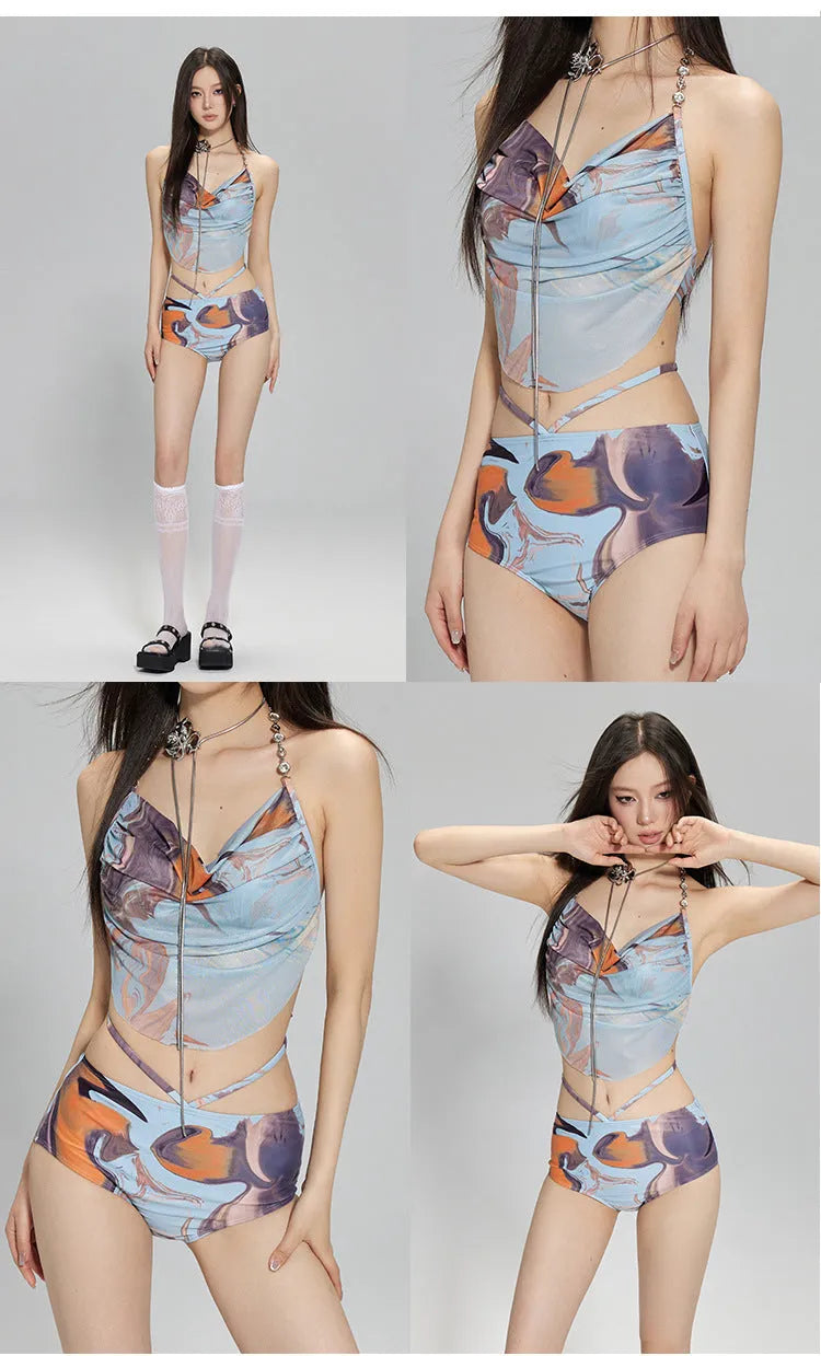 Women's blue printed bikini set with steel support top, pants, and matching skirt laid flat.