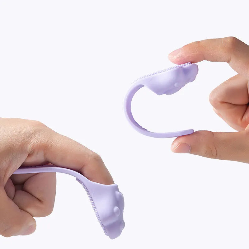 Pink silicone finger toothbrush for dogs and cats with soft nubby bristles.