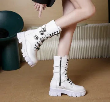 Black women's mid-calf knight boots with metal buckle straps and a side zipper.