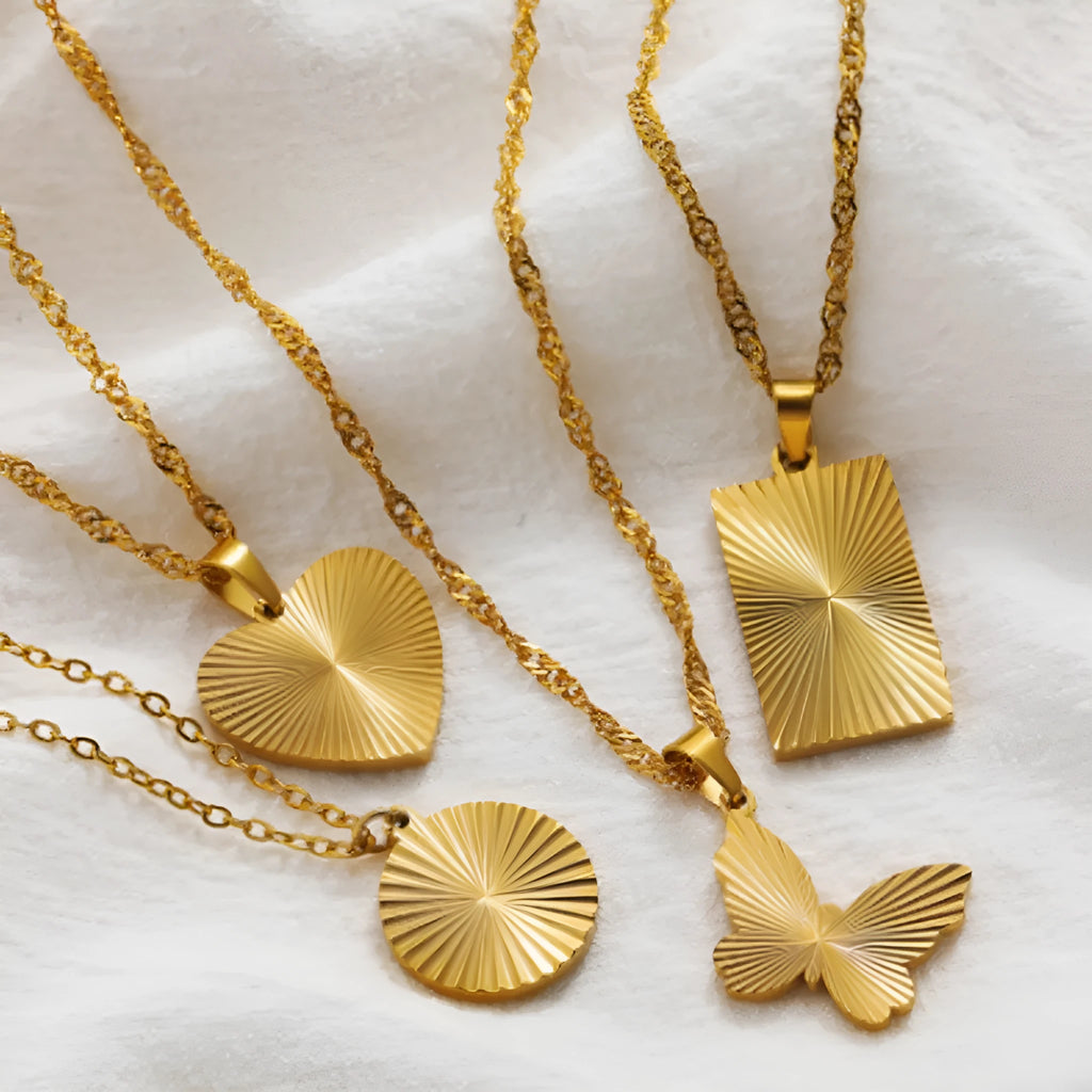 Gold-plated stainless steel necklace with pleated round pendant on water wave chain
