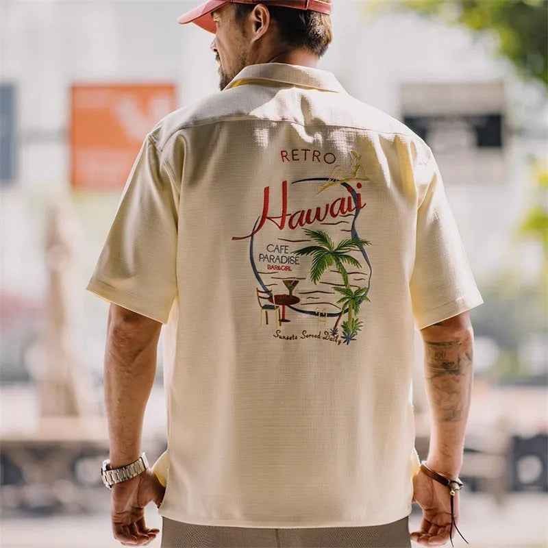 Light apricot men's shirt with bamboo and floral pattern and a Cuban collar