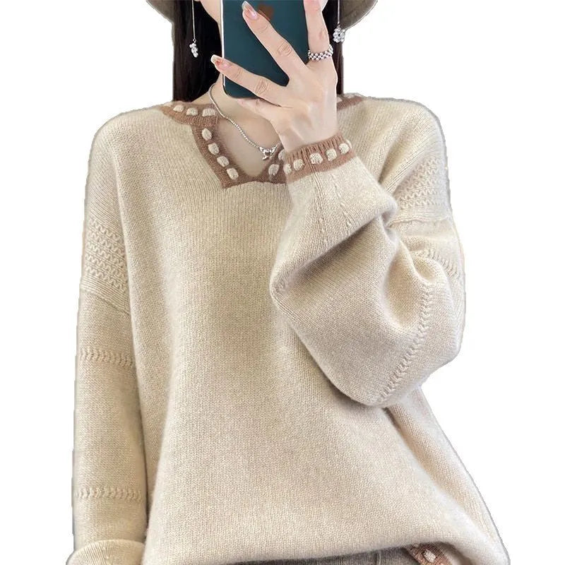 Women's camel coloured V-neck long sleeve pullover sweater on a hanger.