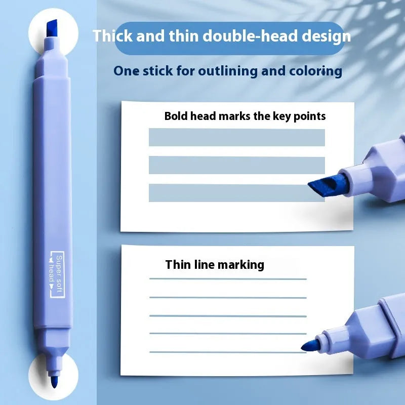 Set of double-ended fluorescent marking pens in assorted bright colours on a white background