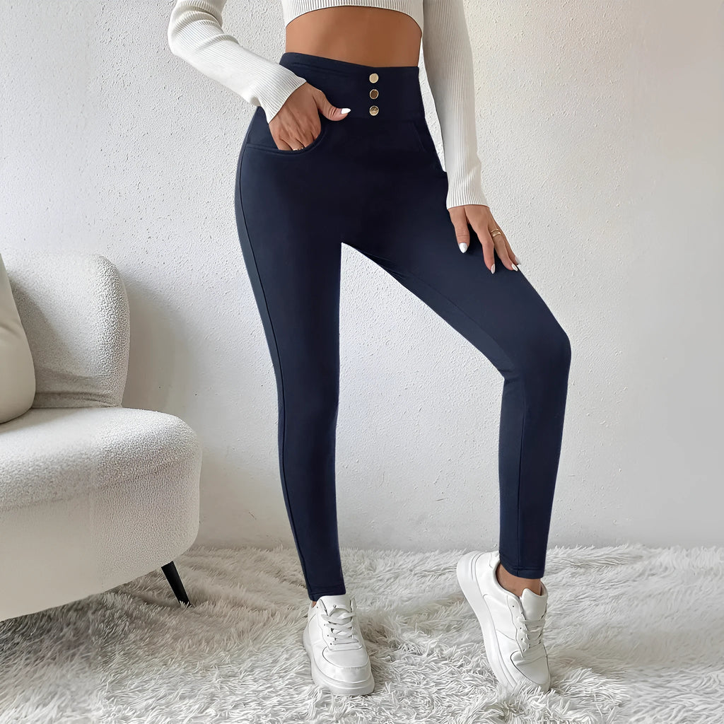 Navy blue women's high waist casual trousers with a straight leg fit on a hanger.